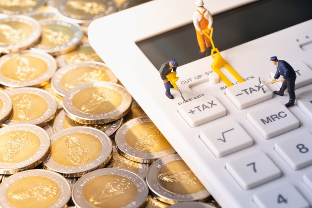 miniature-workers-digging-tax-button-calculator-pile-coins_102644-46.jpg